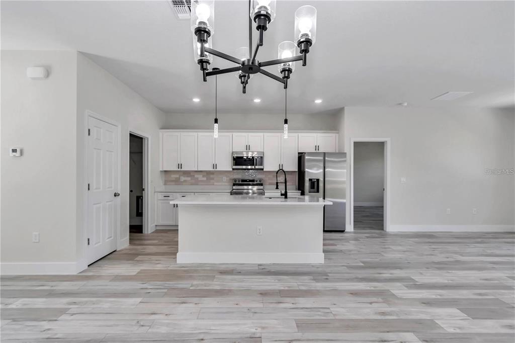 3875 Southwest 169th Ln Road Ocala, FL 34473 - Photo 21 of 46 a view of kitchen with refrigerator microwave and stove