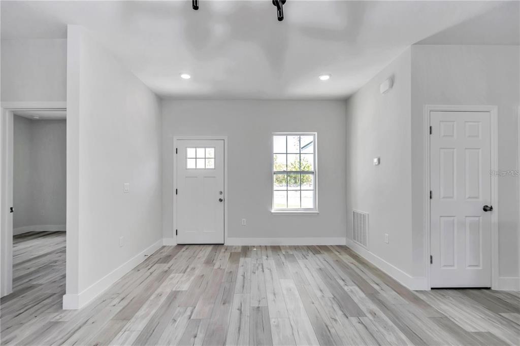3875 Southwest 169th Ln Road Ocala, FL 34473 - Photo 24 of 46 a view of wooden floor and windows in a room