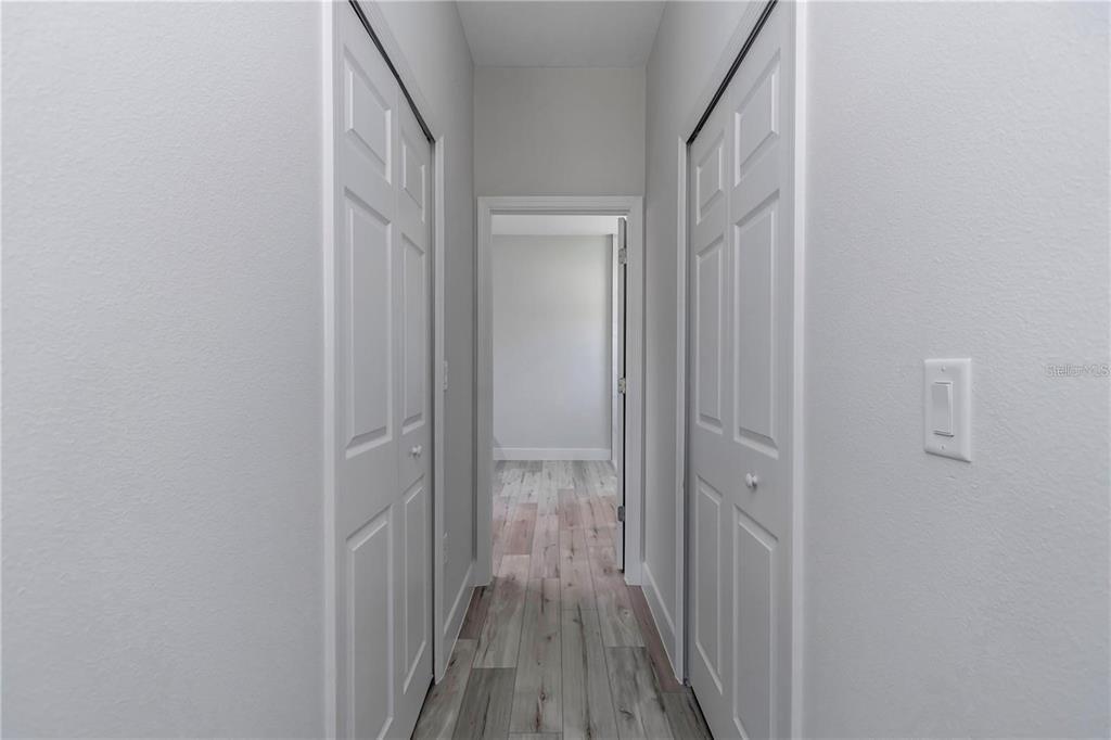 3875 Southwest 169th Ln Road Ocala, FL 34473 - Photo 26 of 46 a view of a hallway with wooden floor