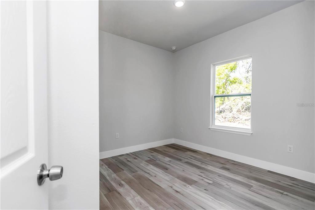 3875 Southwest 169th Ln Road Ocala, FL 34473 - Photo 30 of 46 an empty room with a window