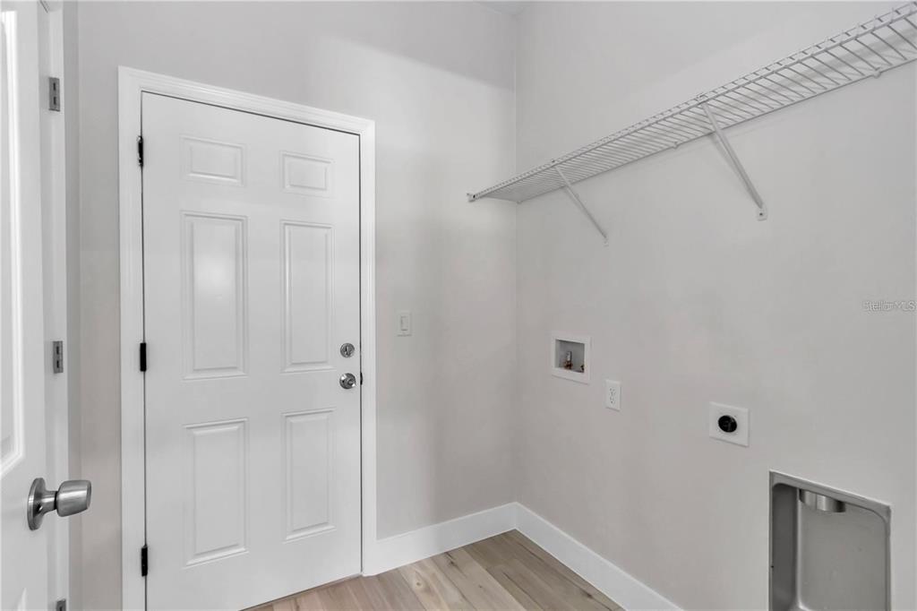 3875 Southwest 169th Ln Road Ocala, FL 34473 - Photo 37 of 46 a view of a hallway with wooden floor