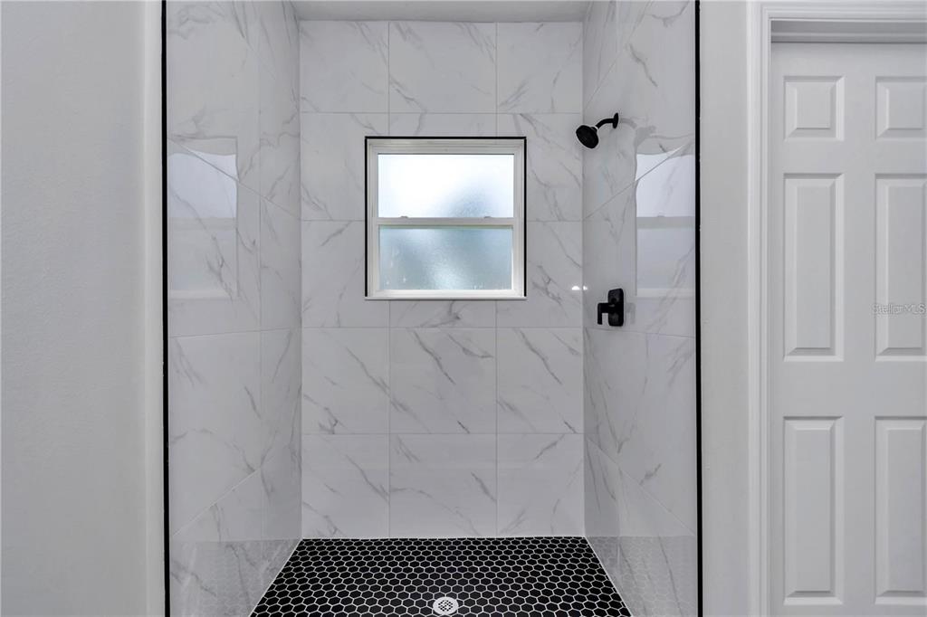 3875 Southwest 169th Ln Road Ocala, FL 34473 - Photo 38 of 46 a bathroom with a shower