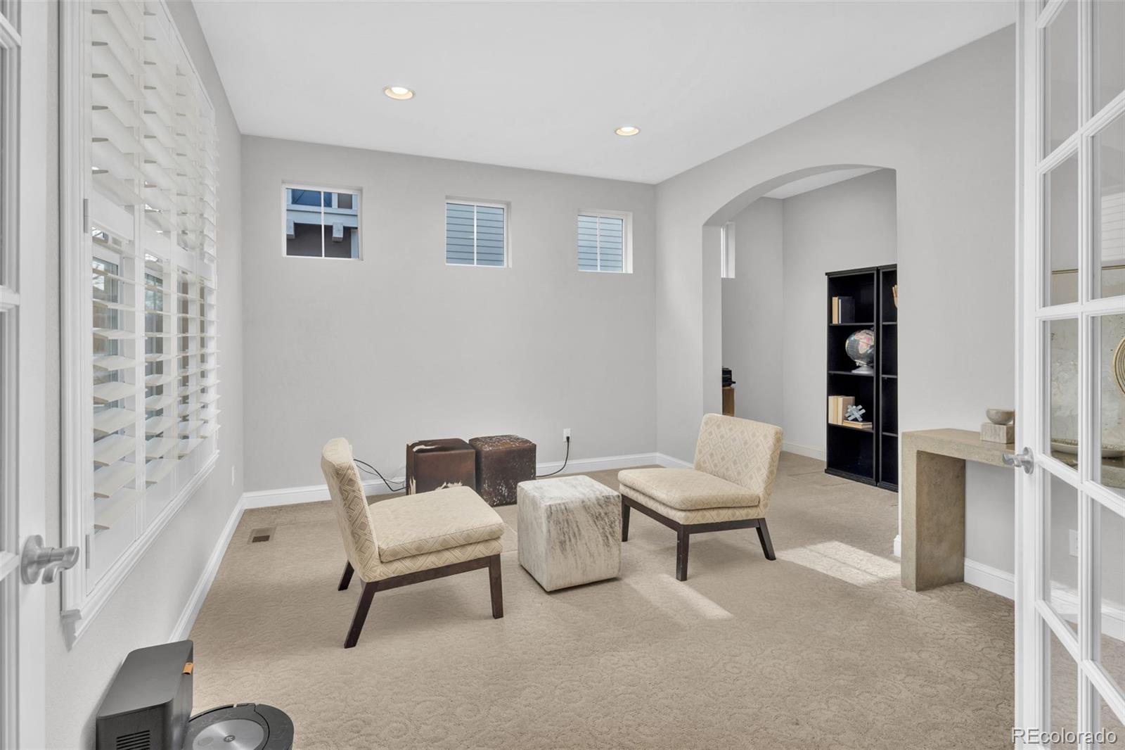 9575 3rd Place Denver, CO 80230 - Photo 13 of 38 a living room with furniture and wooden floor