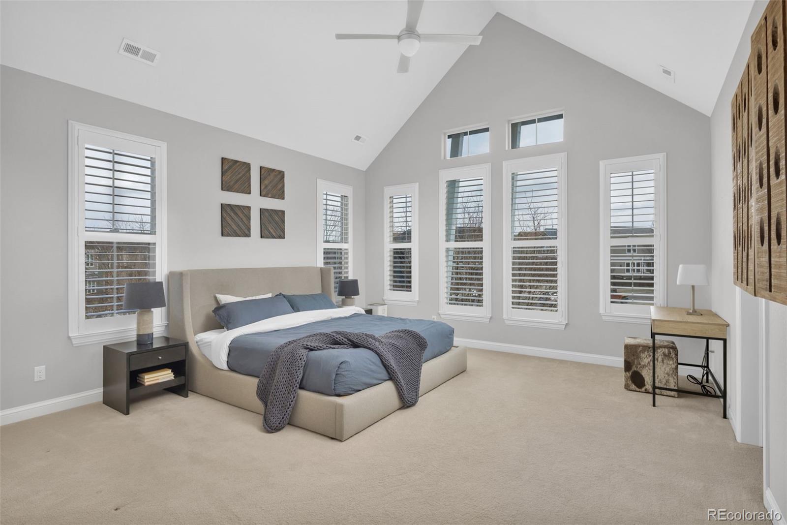 9575 3rd Place Denver, CO 80230 - Photo 17 of 38 a spacious bedroom with a bed and a large window