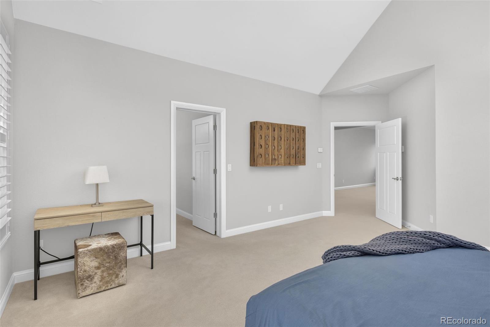 9575 3rd Place Denver, CO 80230 - Photo 18 of 38 a bedroom with a bed and a lamp on table