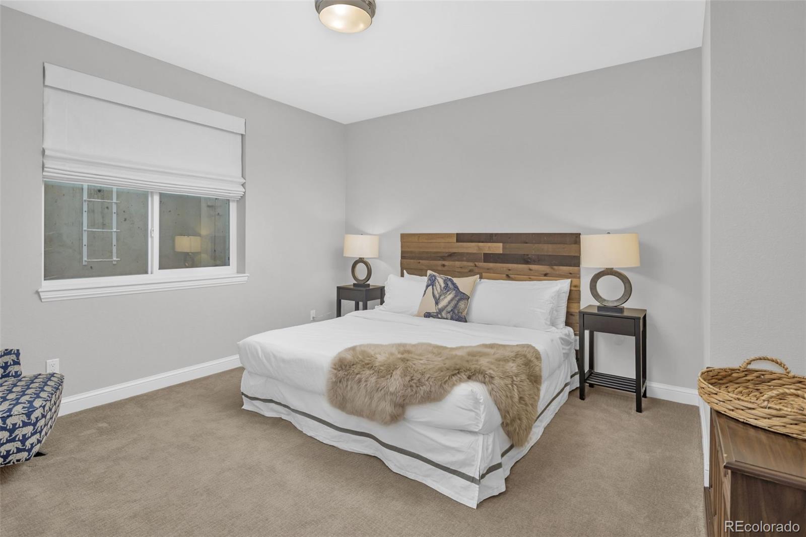 9575 3rd Place Denver, CO 80230 - Photo 30 of 38 a bedroom with a bed and a window