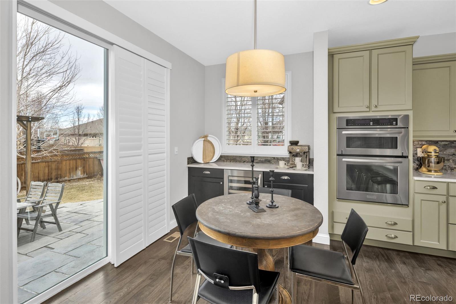 9575 3rd Place Denver, CO 80230 - Photo 8 of 38 a view of a dining room with furniture window and wooden floor