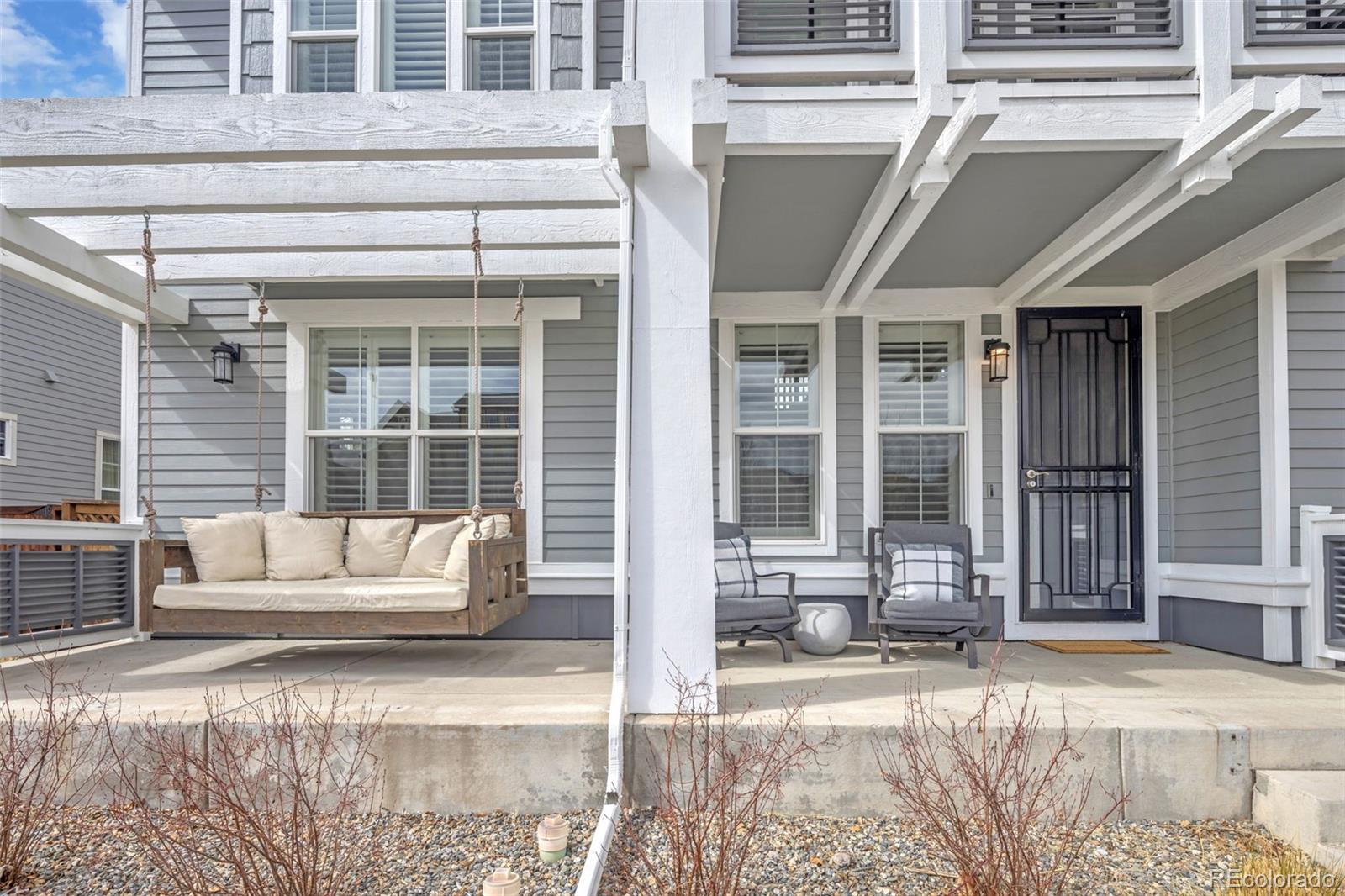 9575 3rd Place Denver, CO 80230 - Photo 9 of 38 a view of a building with couch and door