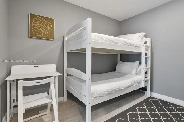 a bathroom with a sink vanity and mirror