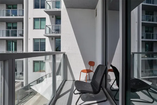 a large kitchen with lots of table and chairs