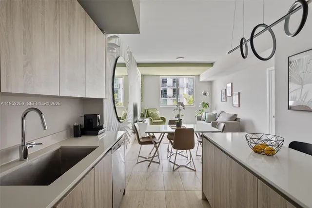 a living room with furniture and a dining table