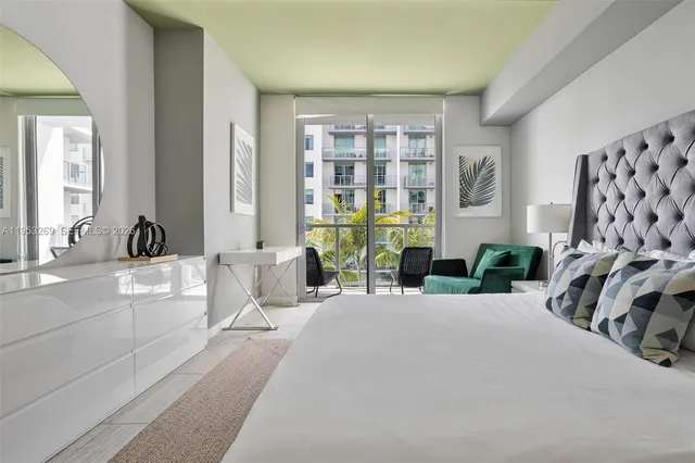 a bedroom with a bed and a couch