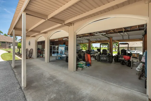 a view of a garage with cars