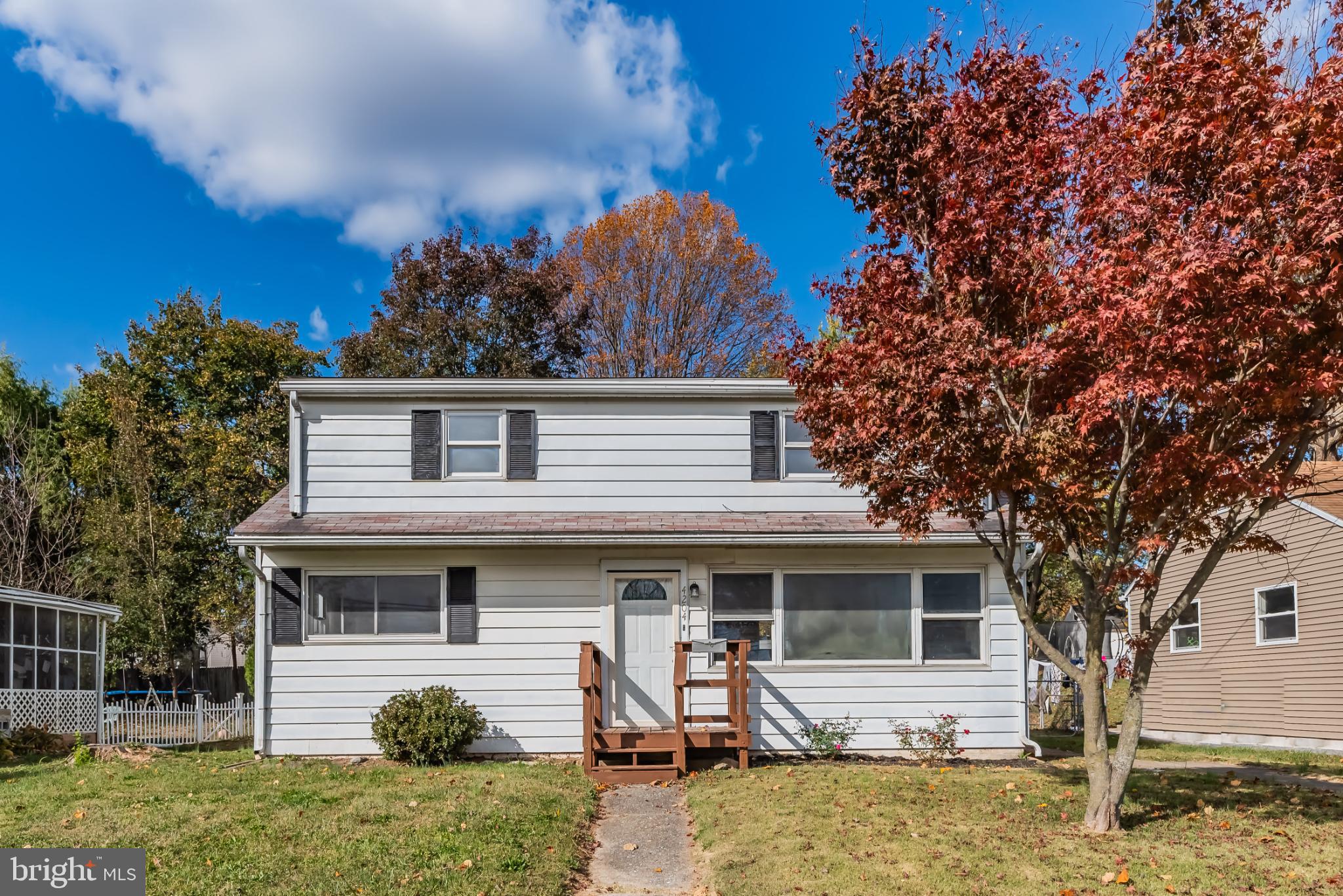 4204 Allen Road Camp Hill, PA 17011 - Photo 2 of 26 a front view of a house with a yard tree and outdoor seating