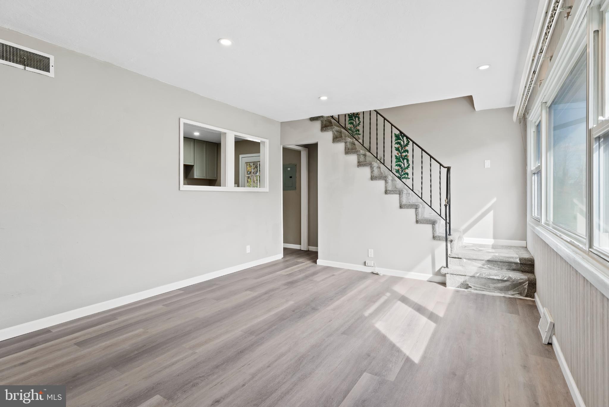 4204 Allen Road Camp Hill, PA 17011 - Photo 5 of 26 a view of an empty room with wooden floor and stairs