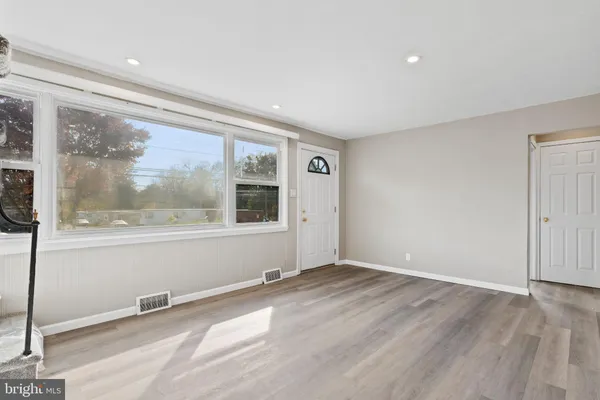a view of an empty room with a window