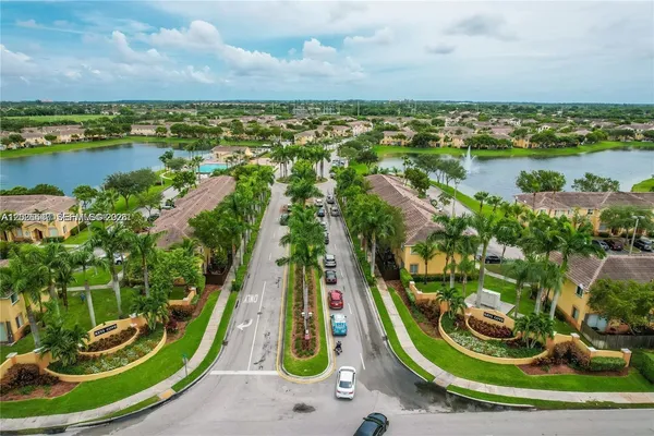an aerial view of residential houses with outdoor space