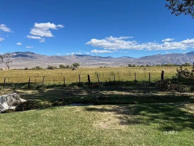 a view of an ocean with a mountain