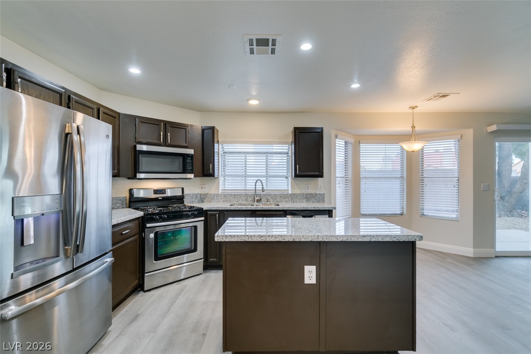 1738 Toltec Circle Henderson, NV 89014 - Photo 13 of 46 An inviting kitchen with modern appliances and ample counter space.