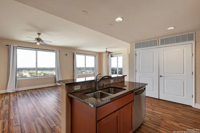 a kitchen that has a sink and a stove
