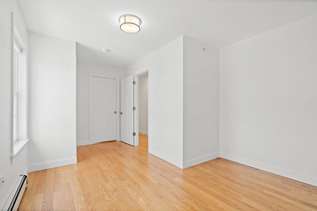 16 Hodgkins Road, Unit 2 Rockport, MA 01966 - Photo 14 of 19 a view of an empty room with wooden floor
