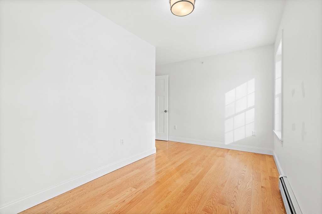 16 Hodgkins Road, Unit 2 Rockport, MA 01966 - Photo 16 of 19 a view of empty room with wooden floor