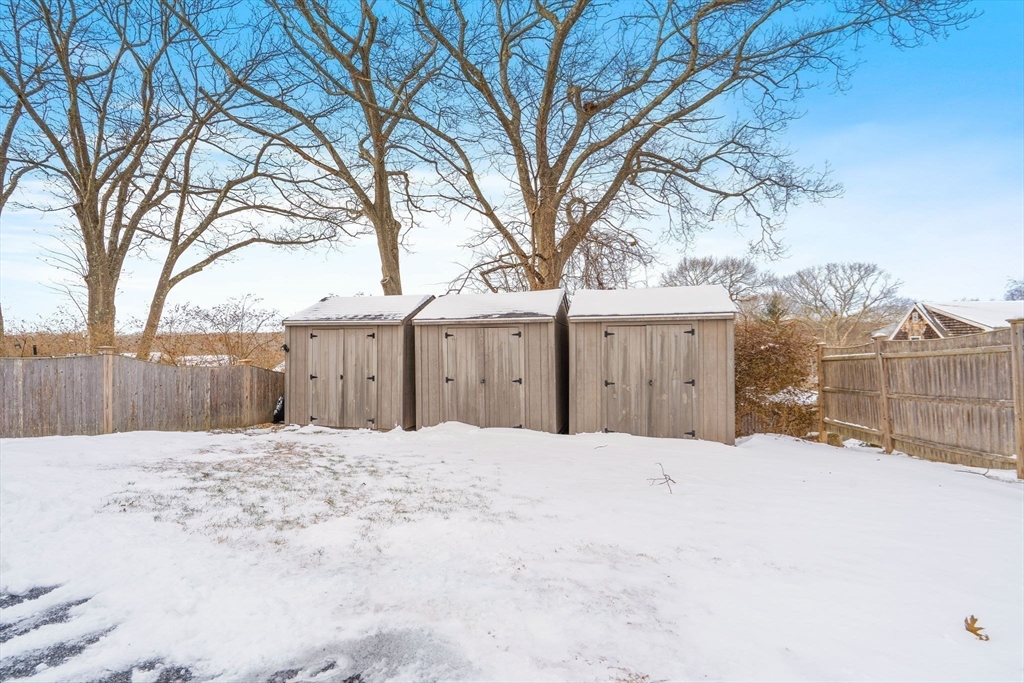 16 Hodgkins Road, Unit 2 Rockport, MA 01966 - Photo 18 of 19 a white house covered with snow in front of house