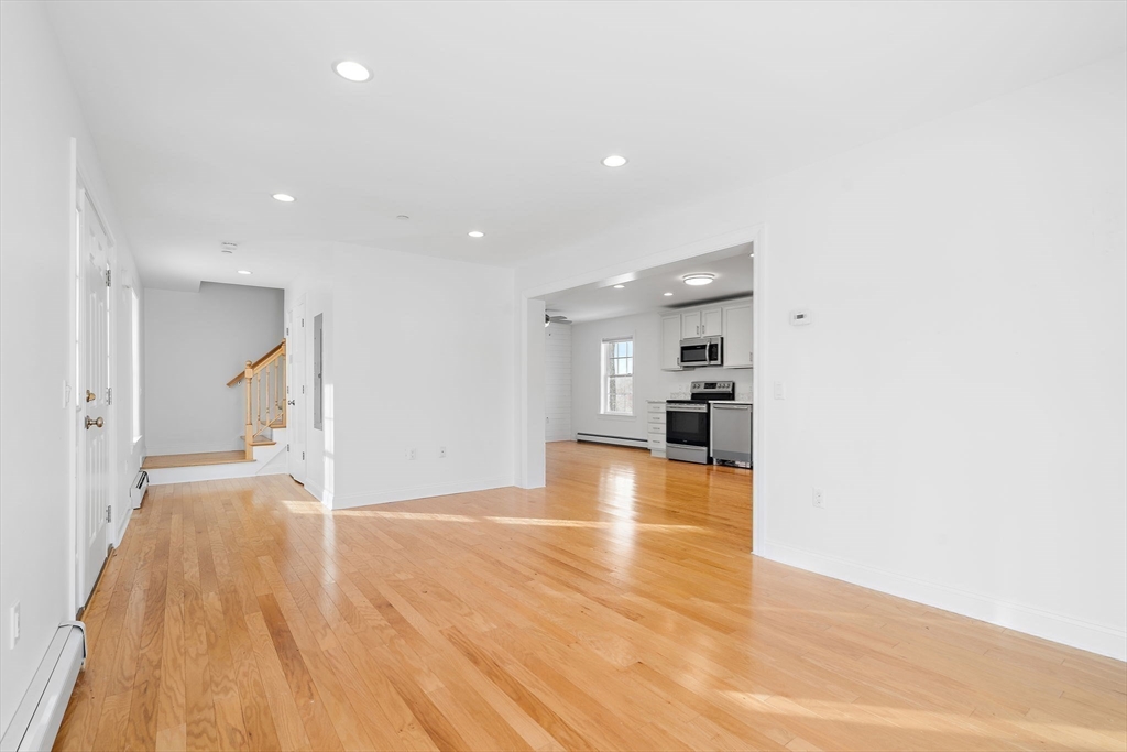 16 Hodgkins Road, Unit 2 Rockport, MA 01966 - Photo 8 of 19 a view of empty room with wooden floor