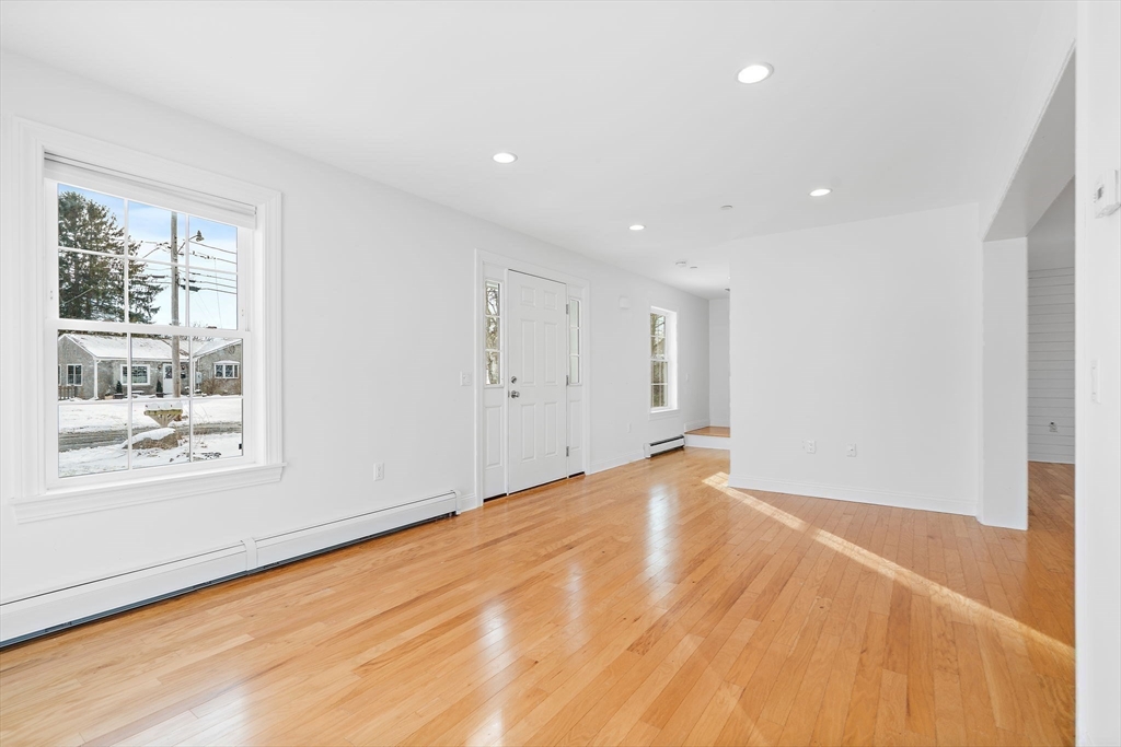 16 Hodgkins Road, Unit 2 Rockport, MA 01966 - Photo 9 of 19 a view of empty room with wooden floor and fan