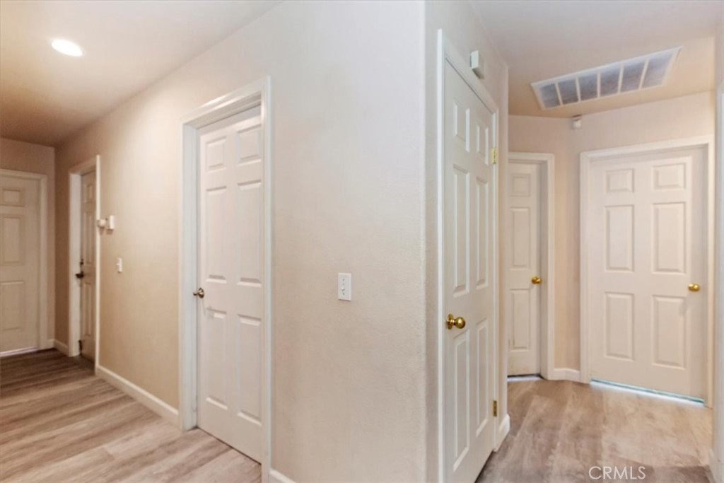 12278 Shadow Drive Victorville, CA 92392 - Photo 14 of 32 a view of a bathroom with wooden floor