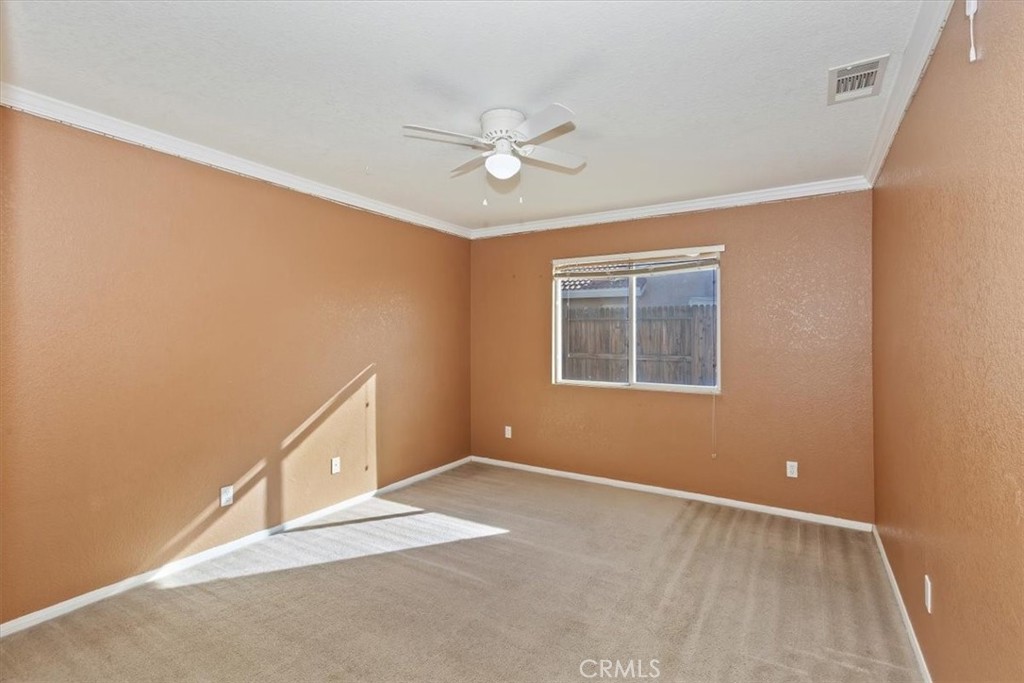 12278 Shadow Drive Victorville, CA 92392 - Photo 17 of 32 a view of an empty room with a window