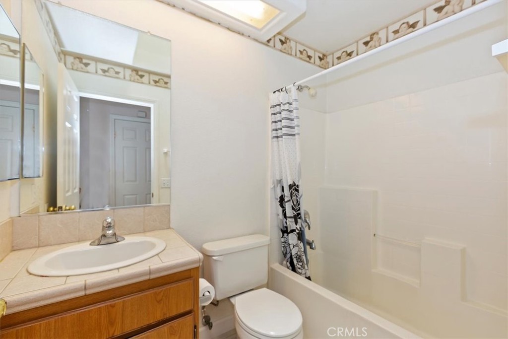 12278 Shadow Drive Victorville, CA 92392 - Photo 18 of 32 a bathroom with a sink a toilet and shower