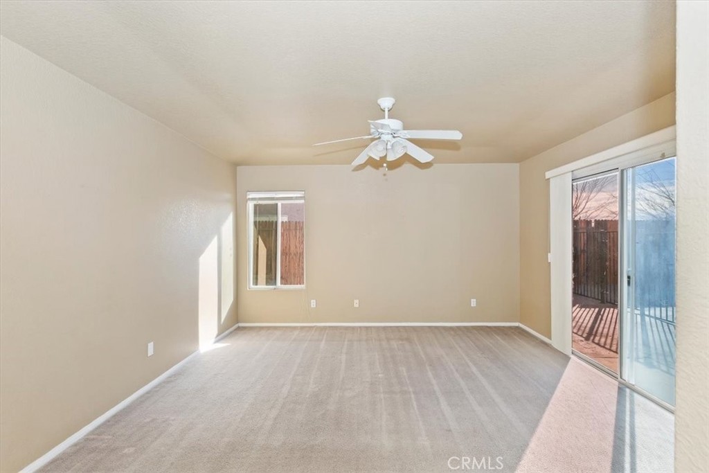 12278 Shadow Drive Victorville, CA 92392 - Photo 20 of 32 wooden floor in an empty room with a window