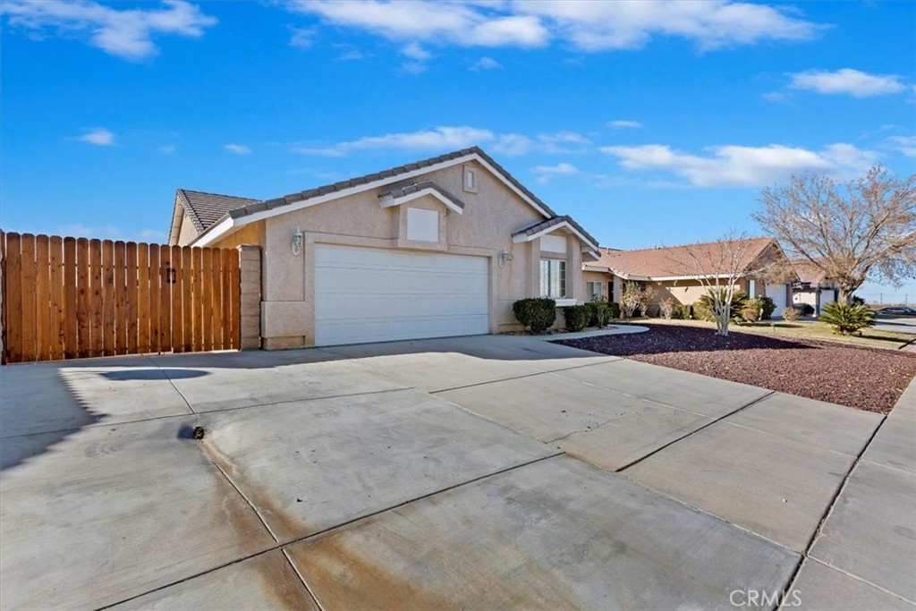 12278 Shadow Drive Victorville, CA 92392 - Photo 2 of 32 a view of garage yard and tree