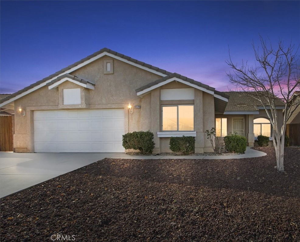 12278 Shadow Drive Victorville, CA 92392 - Photo 21 of 32 a front view of a house with a yard