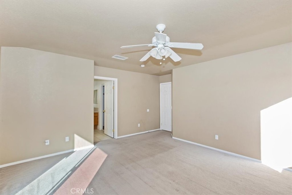 12278 Shadow Drive Victorville, CA 92392 - Photo 22 of 32 wooden floor in an empty room with a window