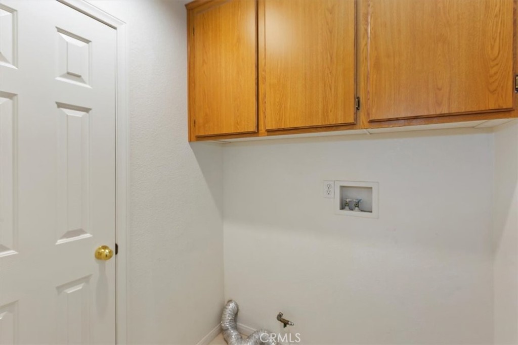 12278 Shadow Drive Victorville, CA 92392 - Photo 25 of 32 a bathroom with a sink and a mirror