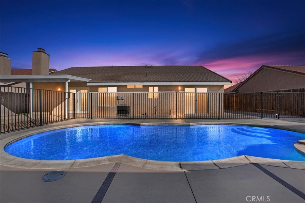 12278 Shadow Drive Victorville, CA 92392 - Photo 27 of 32 a front view of a house with swimming pool