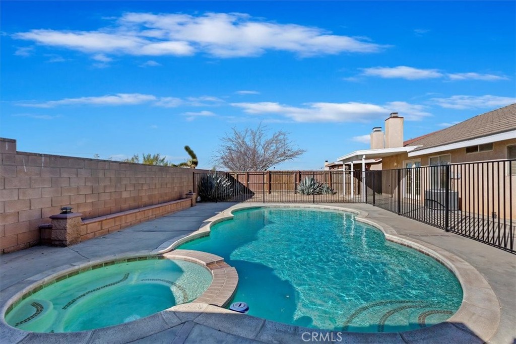 12278 Shadow Drive Victorville, CA 92392 - Photo 30 of 32 a view of a backyard with swimming pool