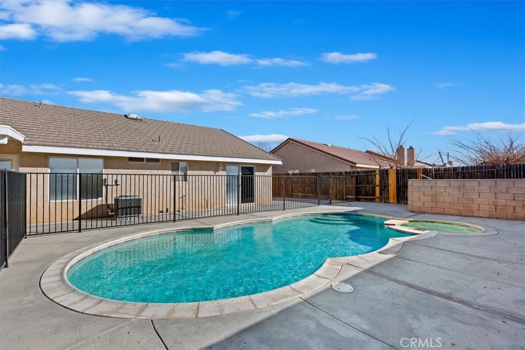 12278 Shadow Drive Victorville, CA 92392 - Photo 31 of 32 a view of a house with backyard and patio
