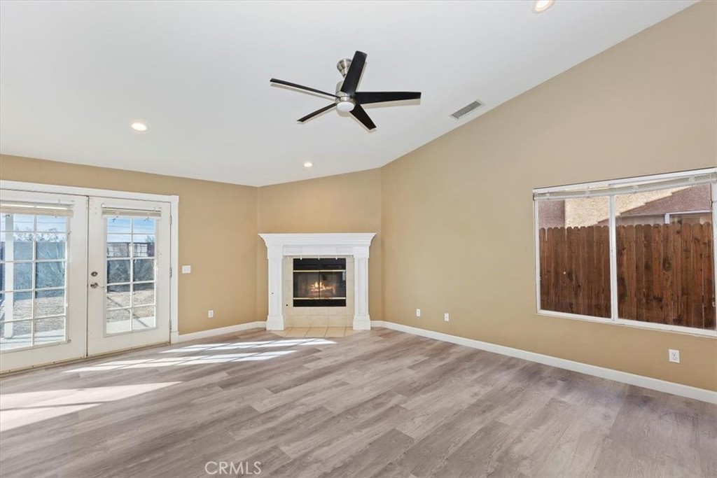 12278 Shadow Drive Victorville, CA 92392 - Photo 8 of 32 a view of a livingroom with a ceiling fan and window