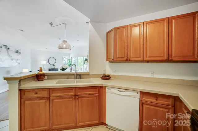 a kitchen that has a sink and a refrigerator