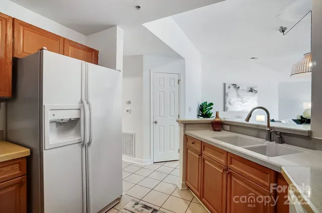a kitchen with a refrigerator sink and microwave