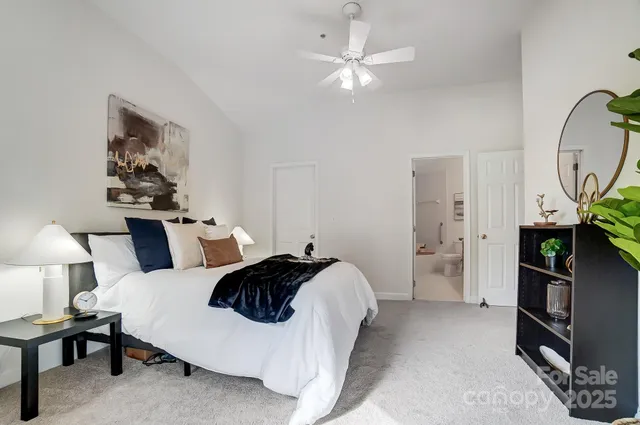 a bedroom with a bed and lamp