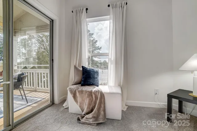 a balcony with wooden floor outdoor seating and city view
