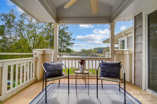 a view of a house with a yard from a balcony