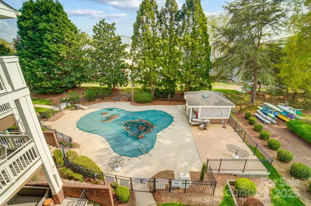 a view of a balcony with chairs and wooden floor