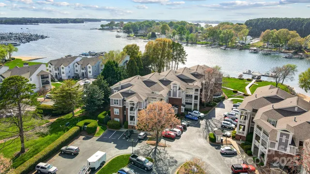 a view of a house with a lake and a mountain view