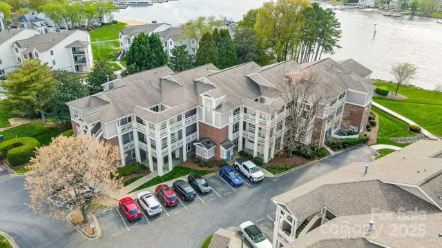 an aerial view of a house with a yard and garden
