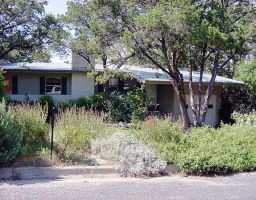 408 Brady Lane Austin, TX 78746 - Photo 1 of 1 a front view of house with a garden